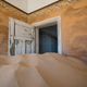 Image for article titled Colorful Desert Ruins Consumed by Waves of Sand